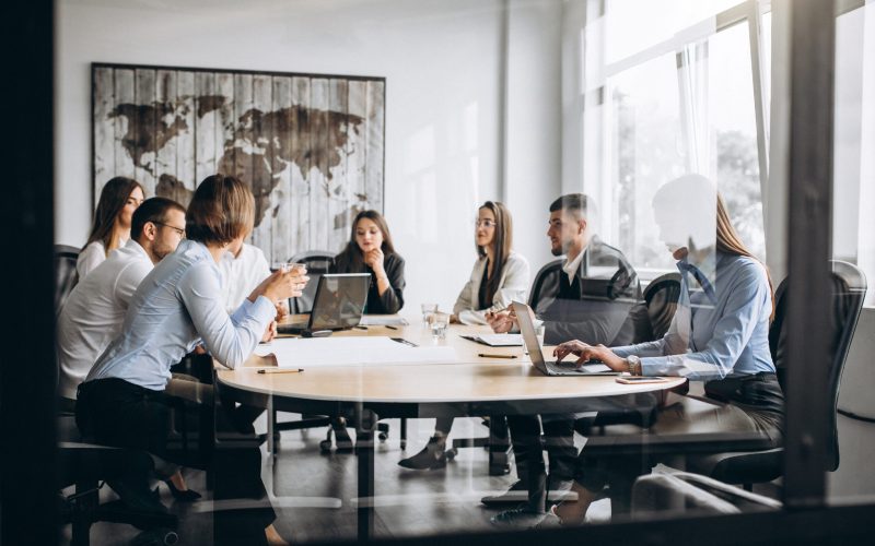 Group of people working out business plan in an office